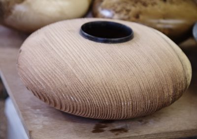 Sandblasted redwood hollow bowl form with ebony rim